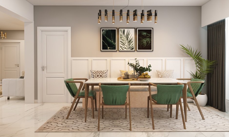 2bhk house dining room has marble top dining table, four chairs with green cushions