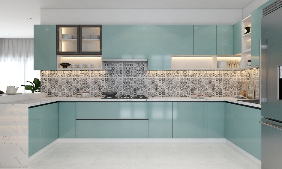Kitchen furniture colour design features soothing pastel blue tones, handleless cabinets, and vibrant Moroccan backsplash