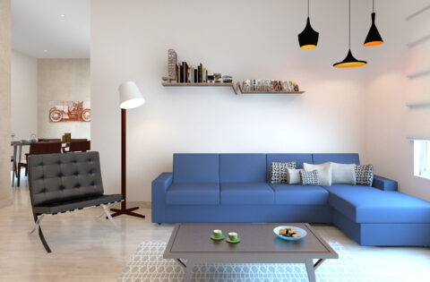 Blue sofa enhances decor with its vibrant hue, offering style and comfort in any living space