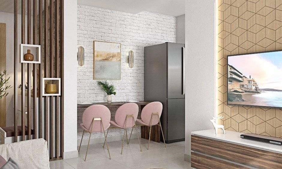 Breakfast table with chairs between living room and kitchen in 1 bhk flat interior design