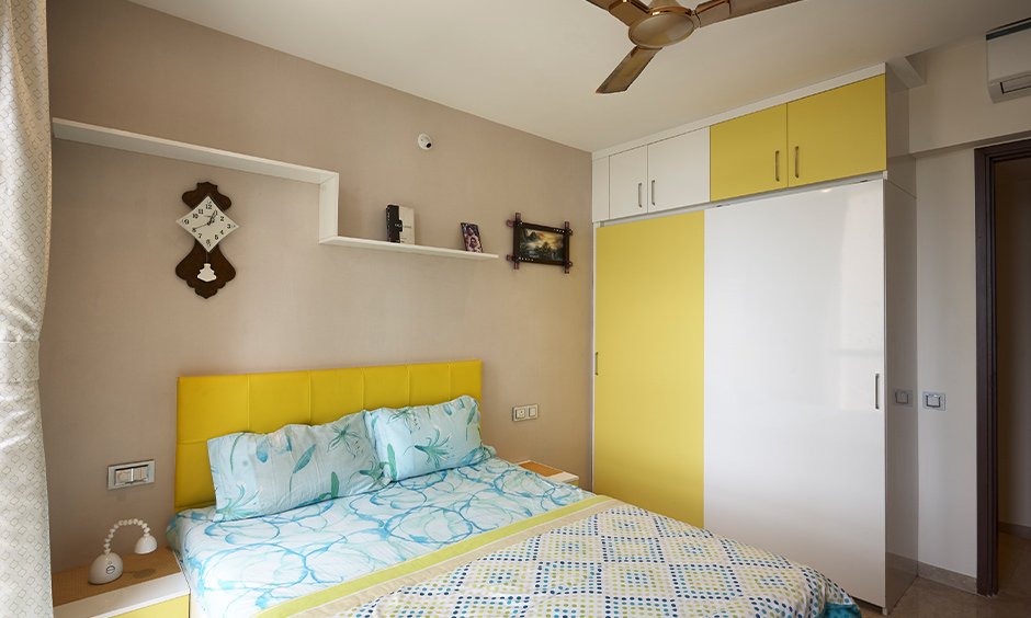 Interior design for home in mumbai with dining table and showcase unit