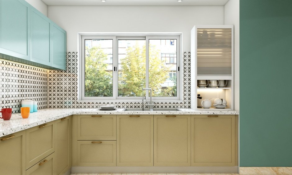 Modular kitchen in a pastel-colored U-shaped layout with integrated crockery unit