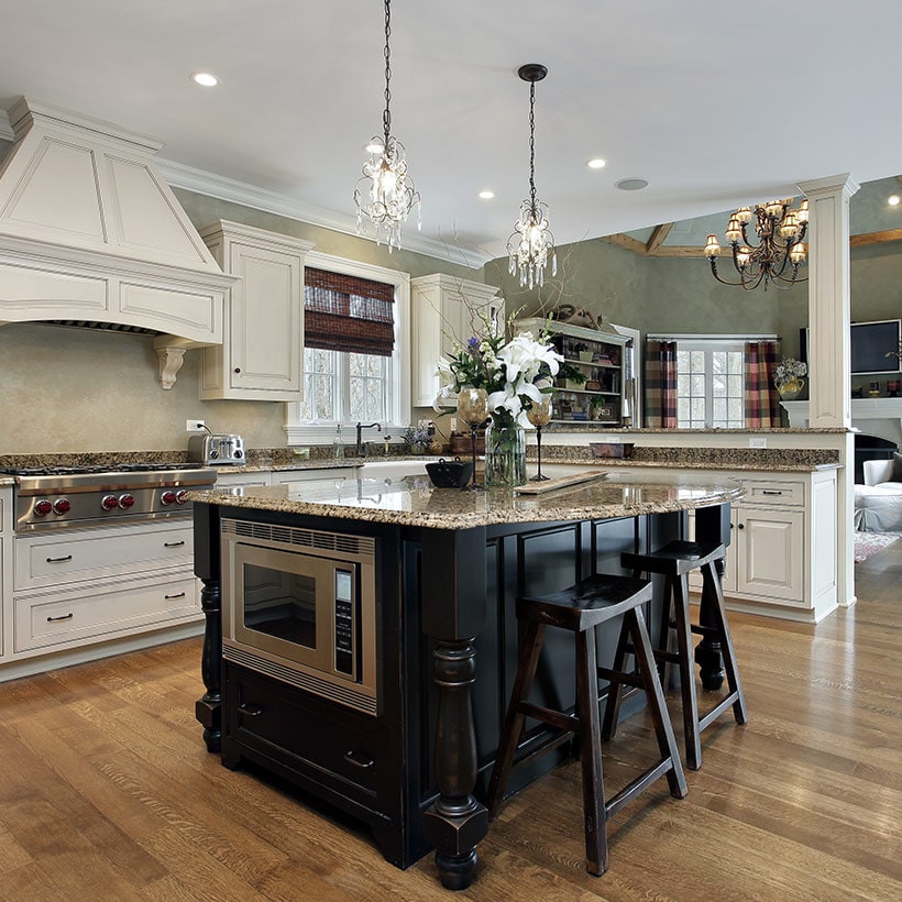 Kitchen island table with a countertop of the island juts out on both sides, providing table space